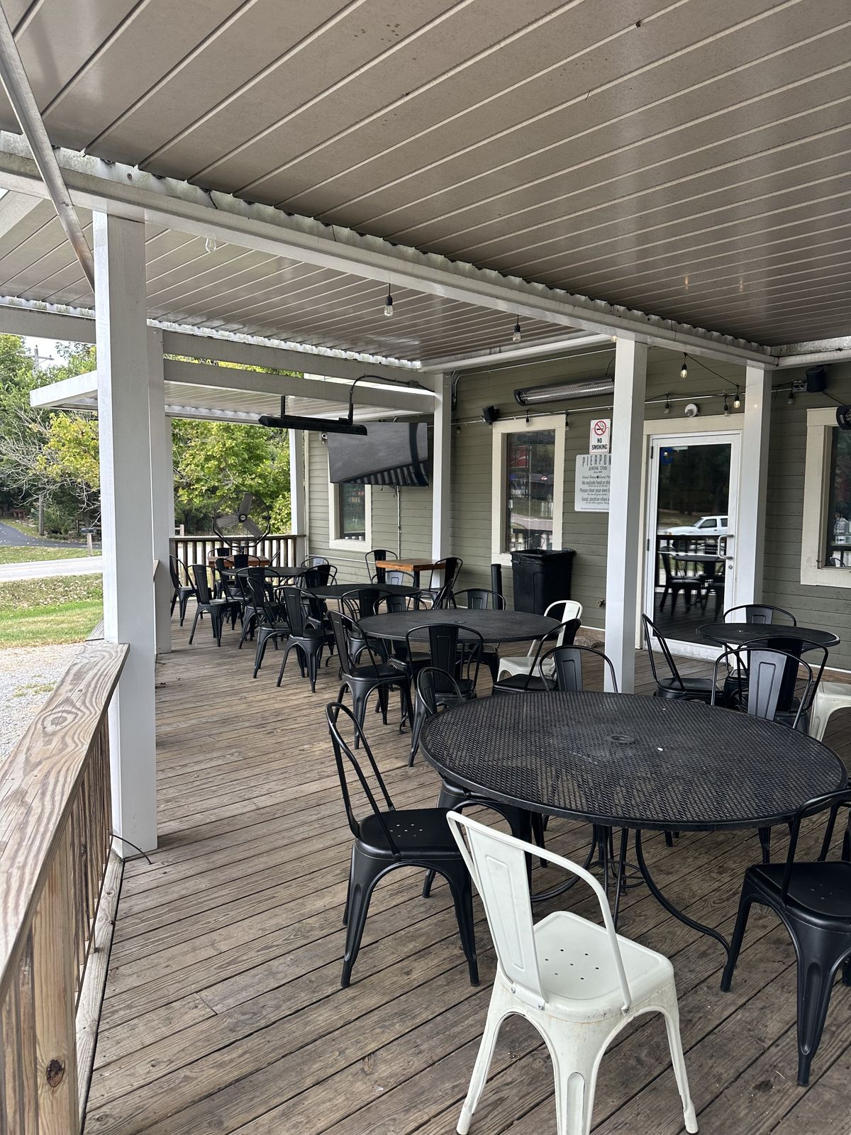 Full porch deck with café seating, radiant heaters and open-air railings