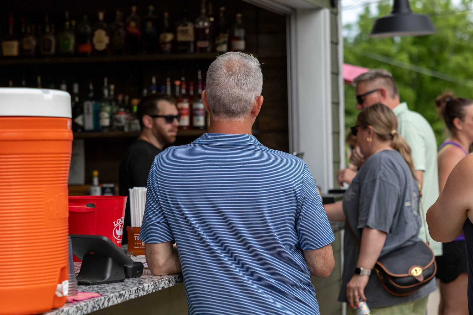 Guests order drinks at Pierpont's outdoor bar window