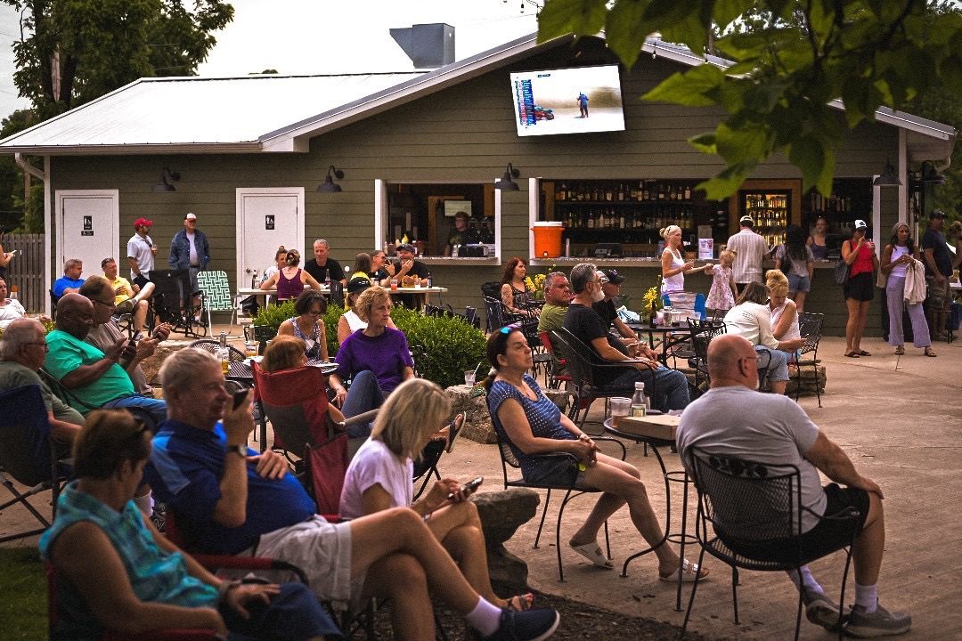 Large gathering of guests filling Pierpont's patio during an event