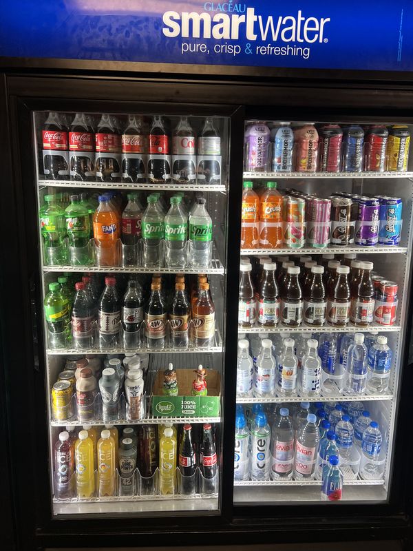 Sodas, water, tea and juice in the store cooler